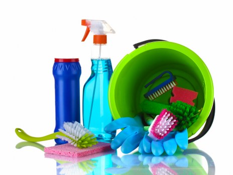 Living room house cleaning essentials with tidy surfaces