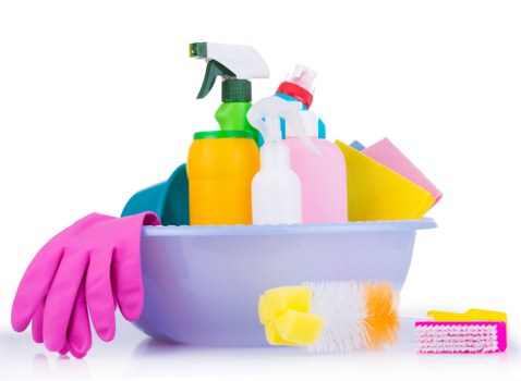 Spot treating a stain on upholstered furniture with a cloth and cleaner